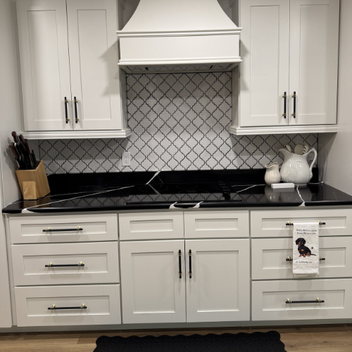 kitchen renovation, black countertops, and white cabinets
